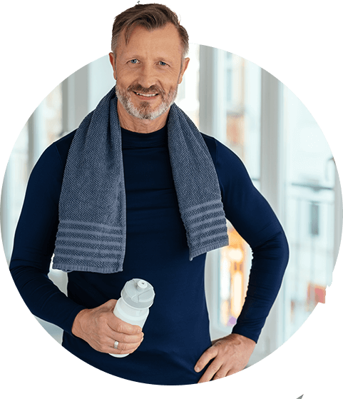 Man after workout holding a water bottle